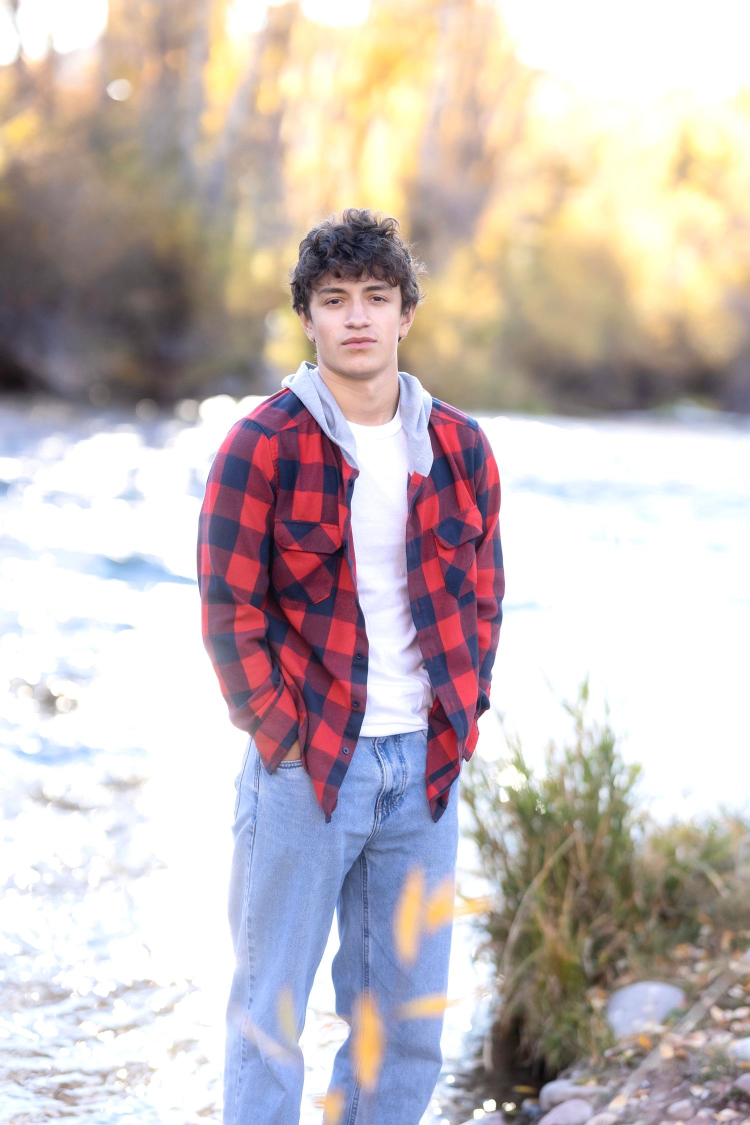 Fall Aspen senior photography with colorful leaves and sunlight
