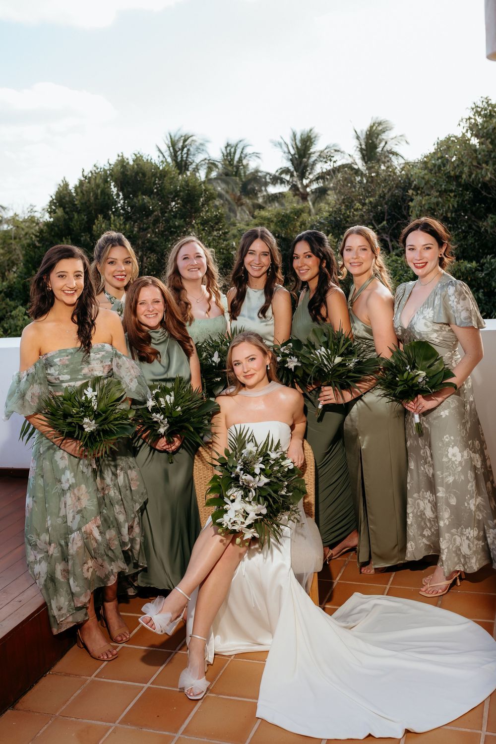 Bride and bridesmaids in Mexico, Vogue portrait alike, all the girls together showing their dresses.
Tulum editorial photographer