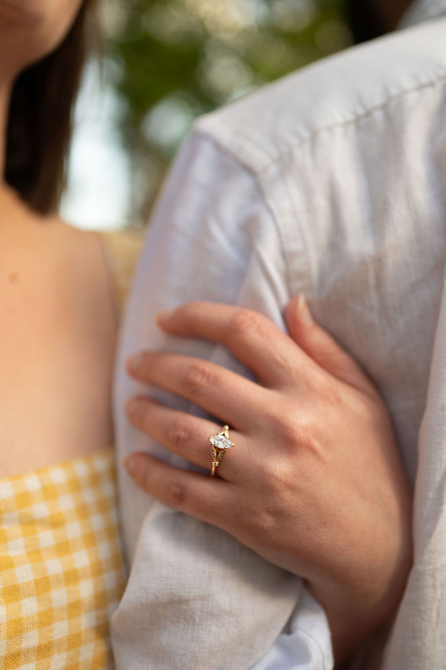 close-up of couple holding hands with engagement rings during golden hour - Upstate Engagement Photography