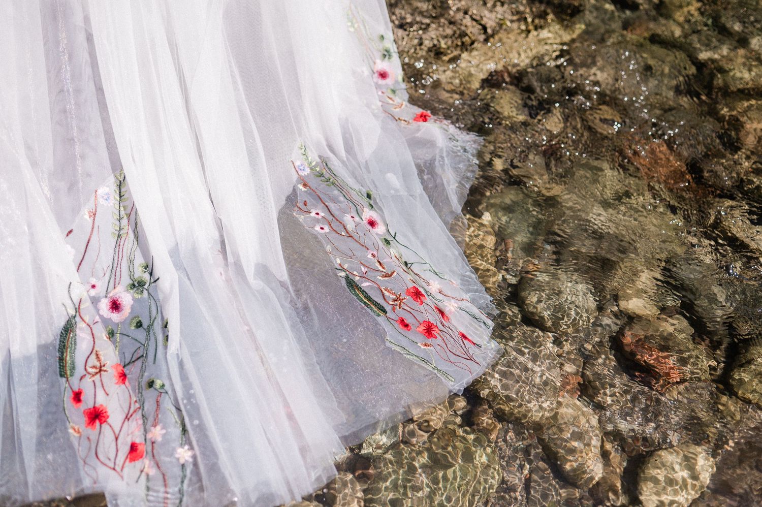 floral wedding gown flowing in river