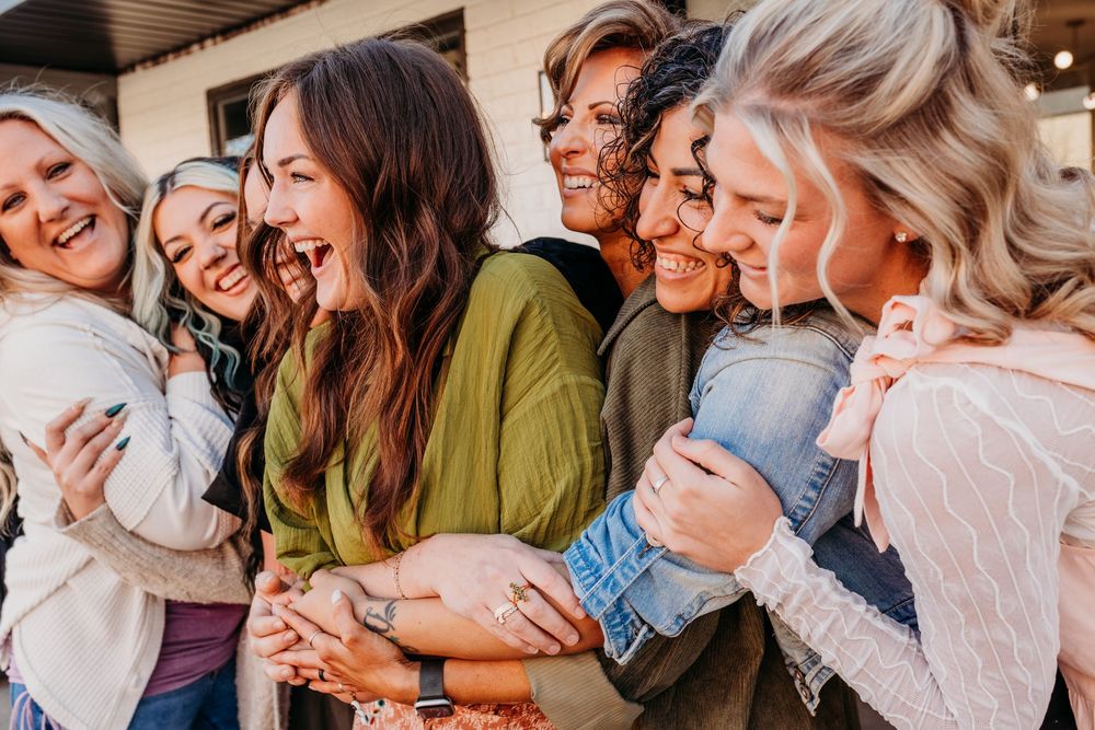 A collection of candid laughing moments captured in a series of connected lifestyle photos.  Creative Photographer, Grand Rapids MI