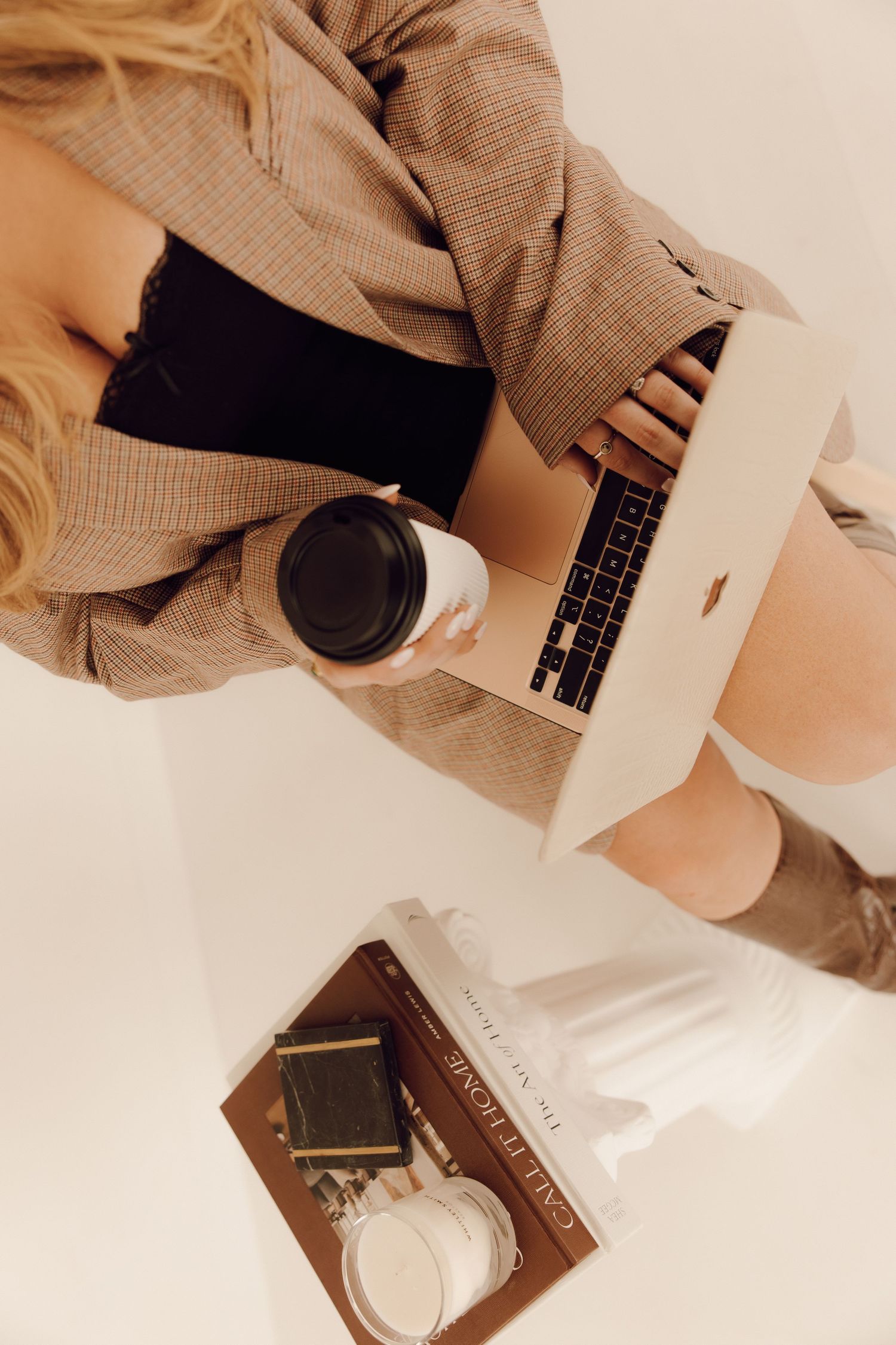 Professional branding photoshoot of a woman entrepreneur in a modern office setting.