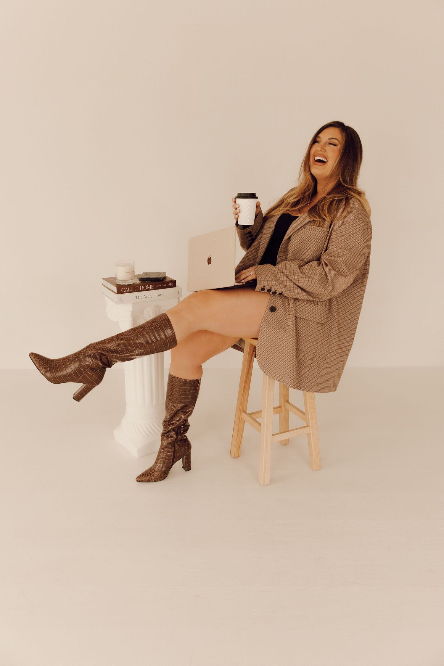 Creative branding photography for a businesswoman, showcasing her brand's personality with clean, stylish imagery.