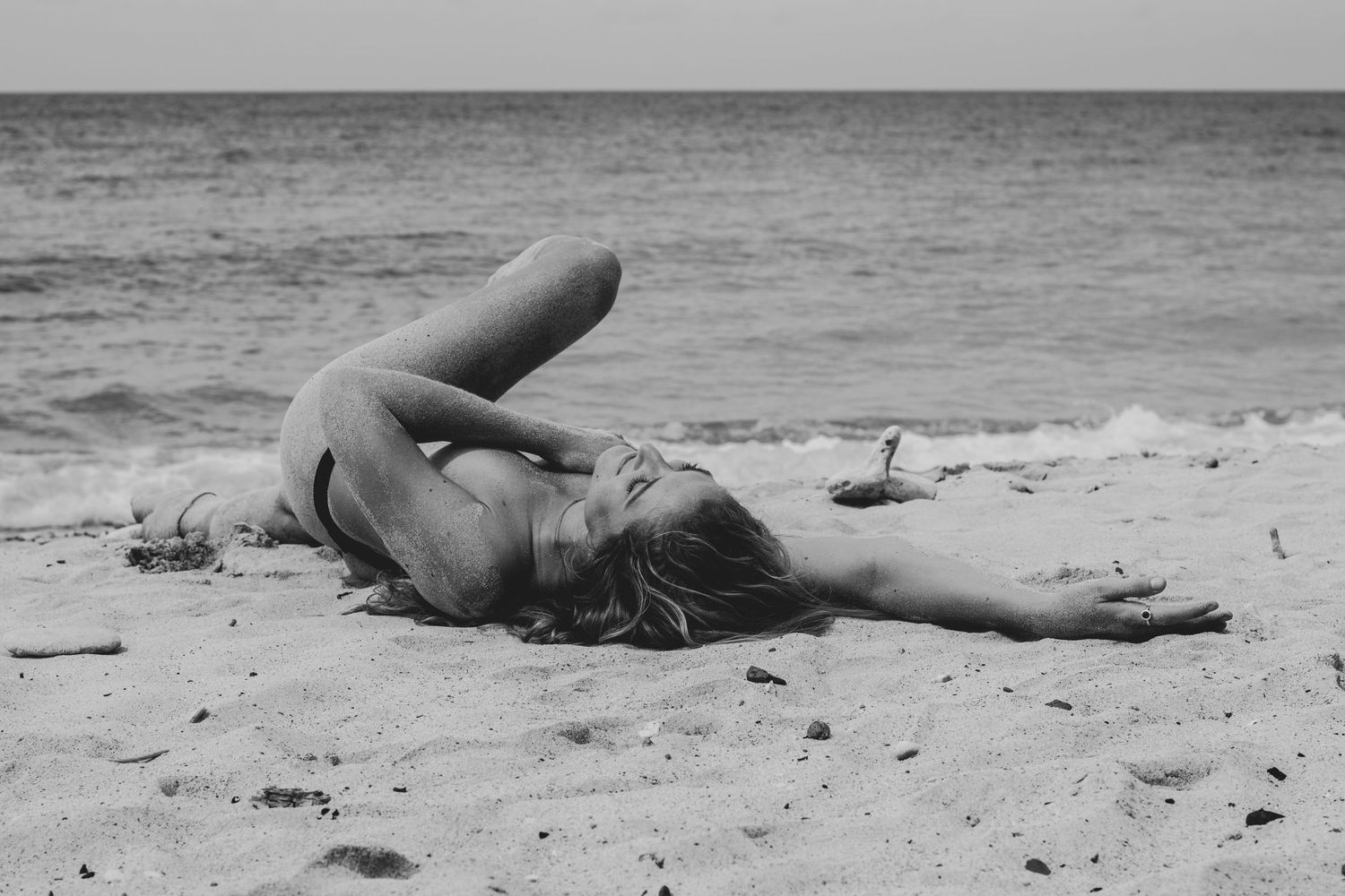 Woman laying on Maui beach
