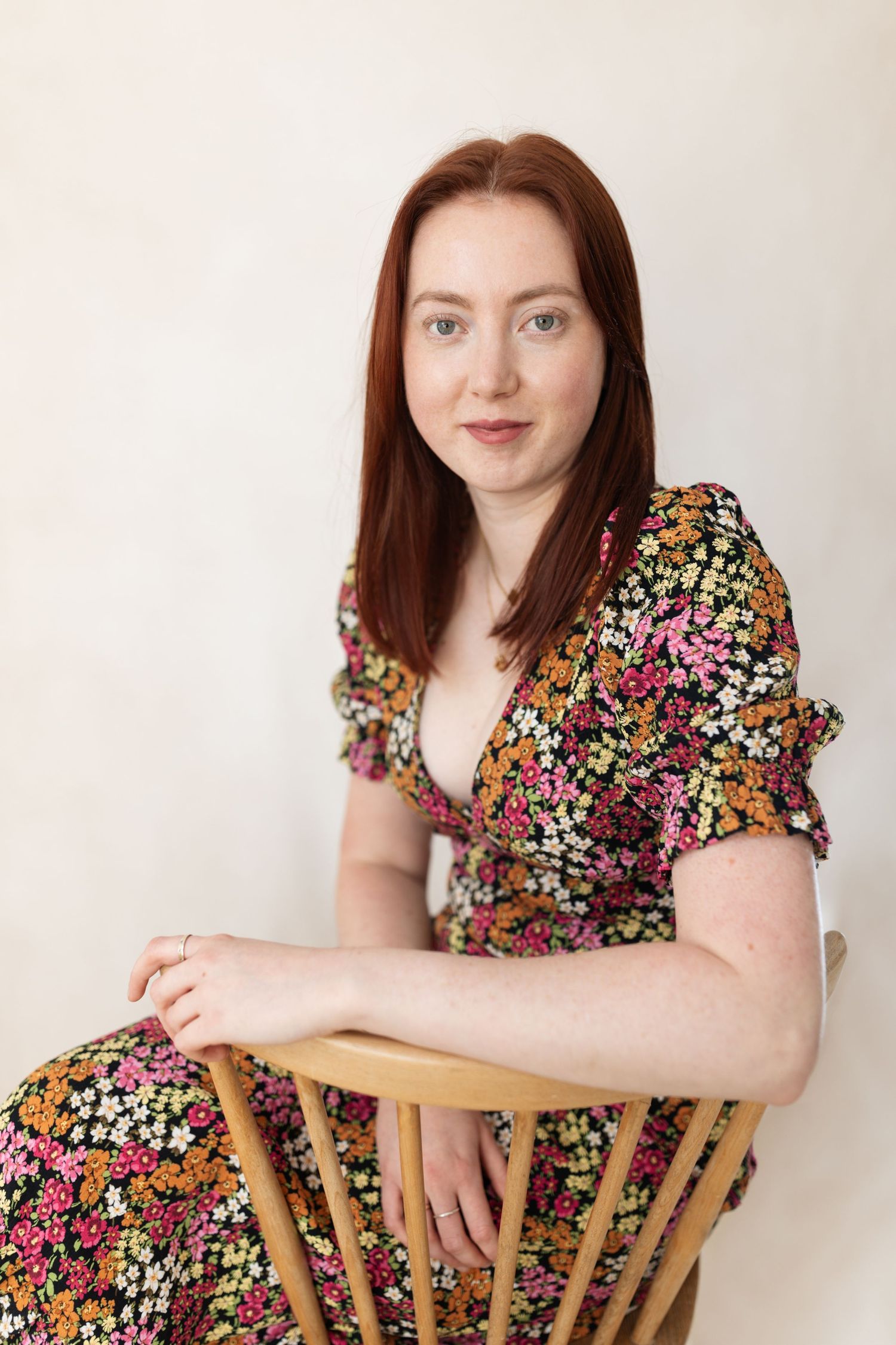 A series of four photos showing someone wearing a black and white gingham top against a light background.