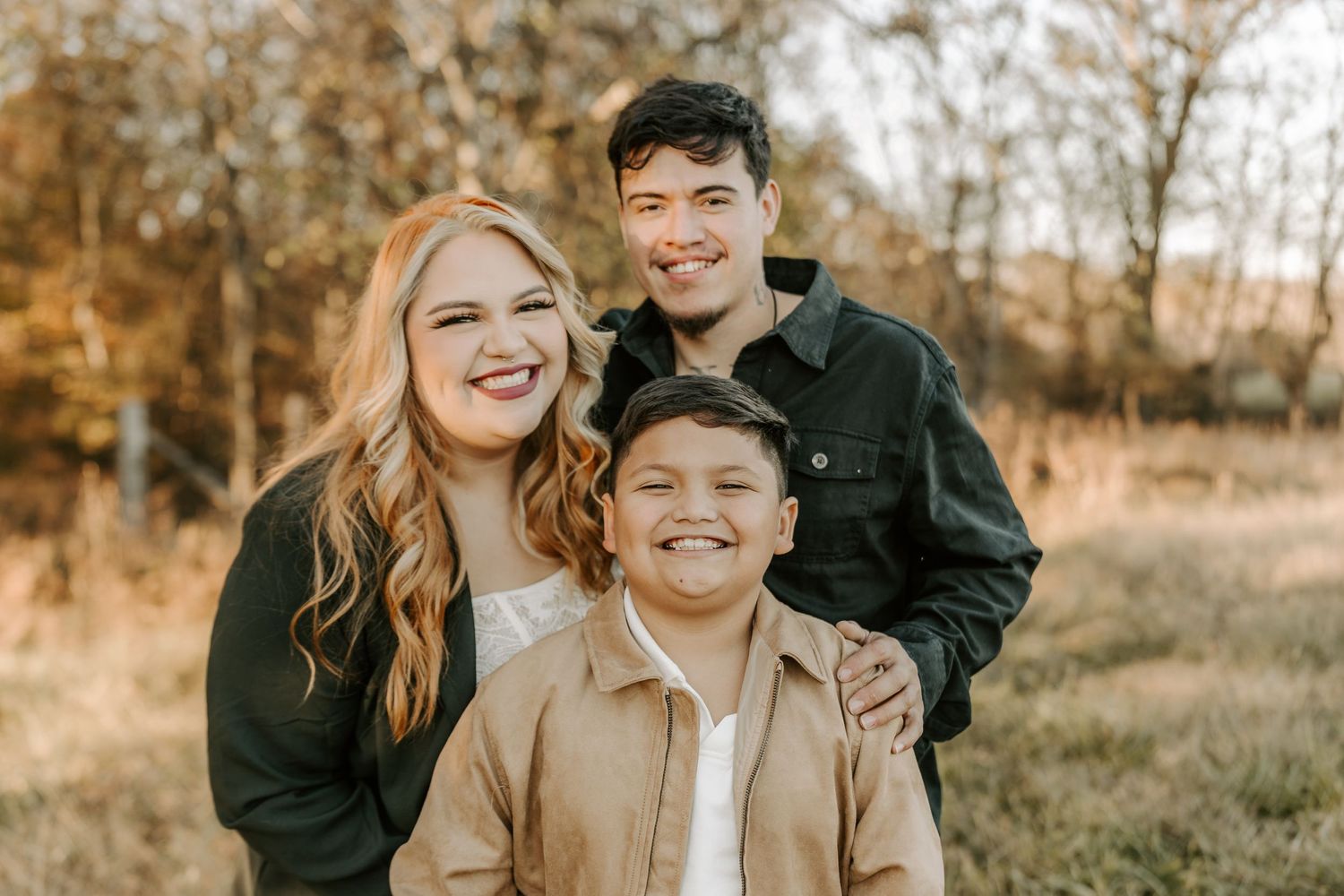 Couple laughing together during casual outdoor portrait session.