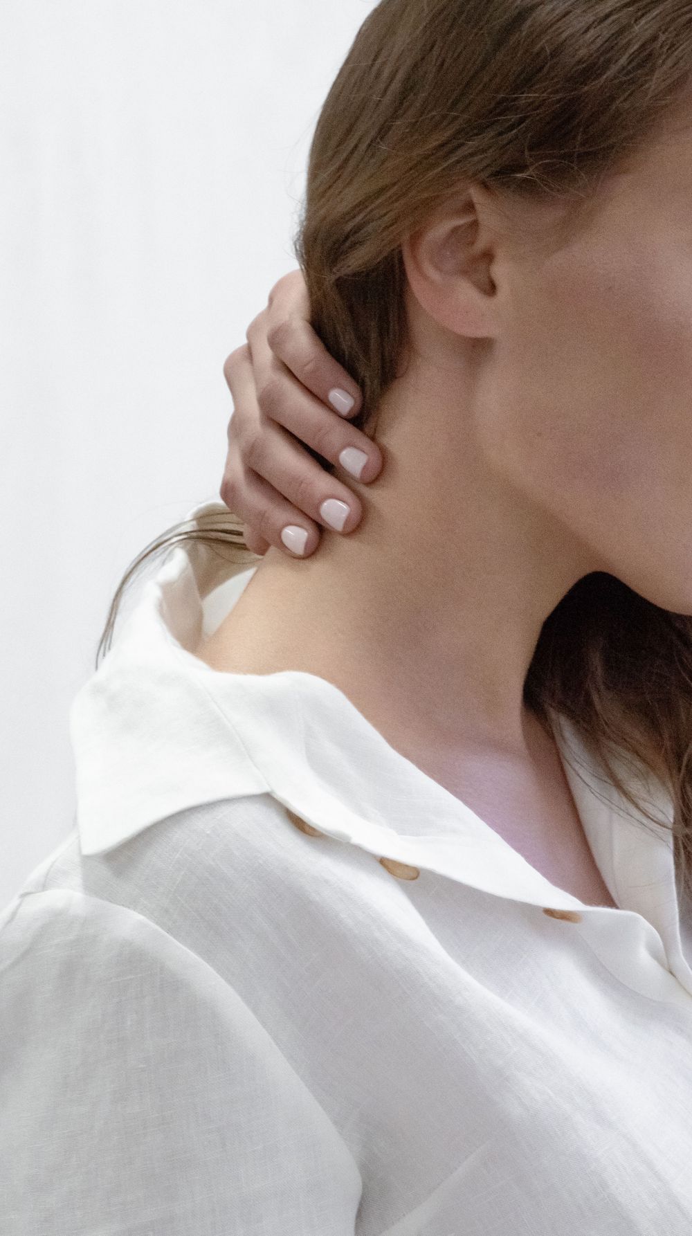 model removing her hair from her neck while having an editorial photoshoot in Kilkenny