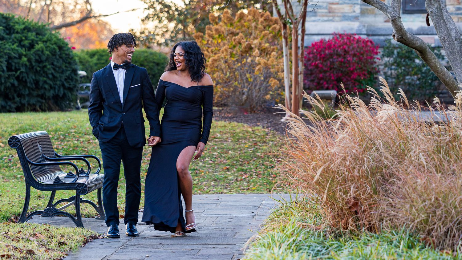 Frederick Maryland Wedding Photographer   - Elegant couple strolling along garden path in formal evening wear.
