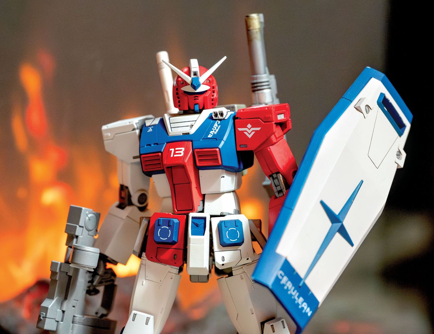 A sequence of toy robot action figures posed against a fiery orange background with dramatic lighting effects.