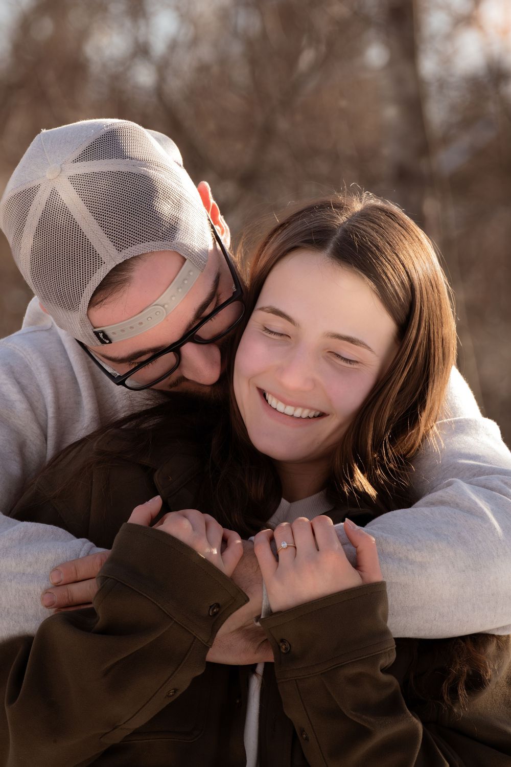 A heartwarming sequence of close-up shots showing tender affection and laughter between two people in casual attire.