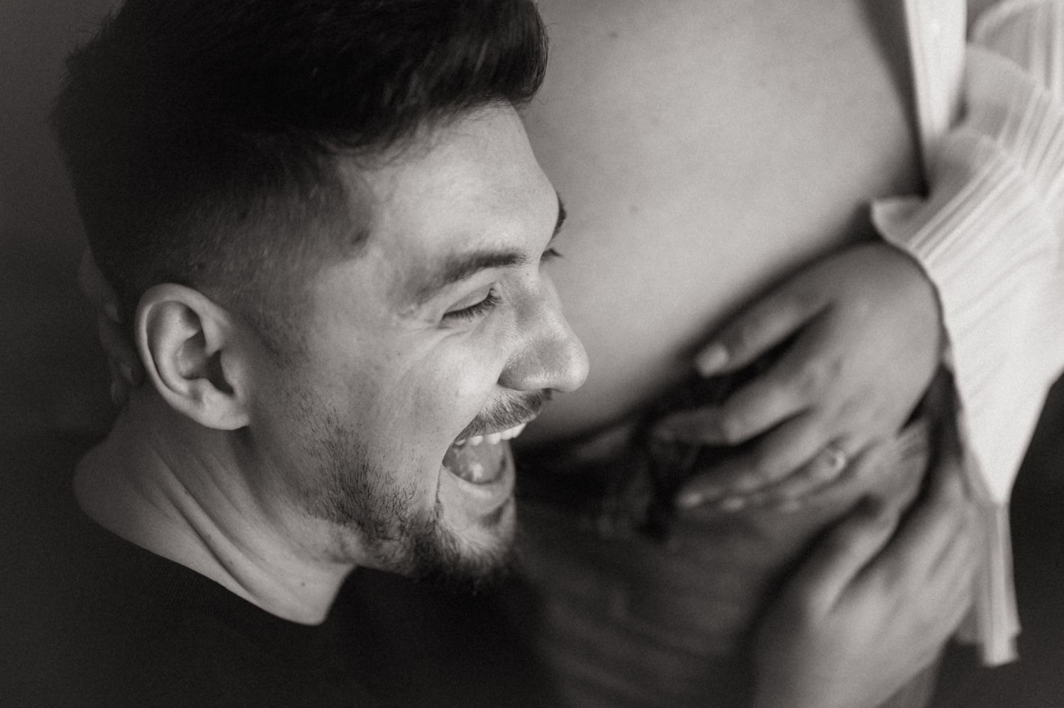 A series of black and white photos showing two people sharing intimate moments and embracing.