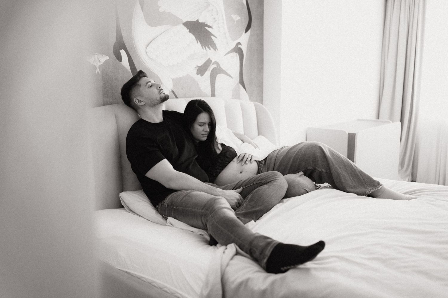 A series of black and white photos showing someone sleeping peacefully in a bright, sunlit bedroom.