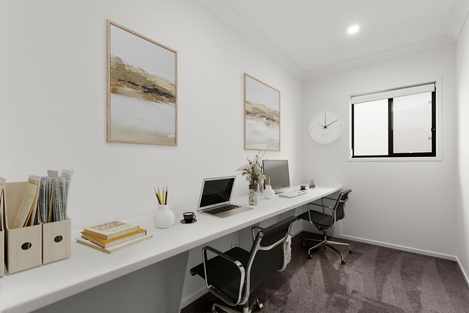 Minimalist home office with long white desk, dual monitors, two office chairs, and coastal artwork on white walls.