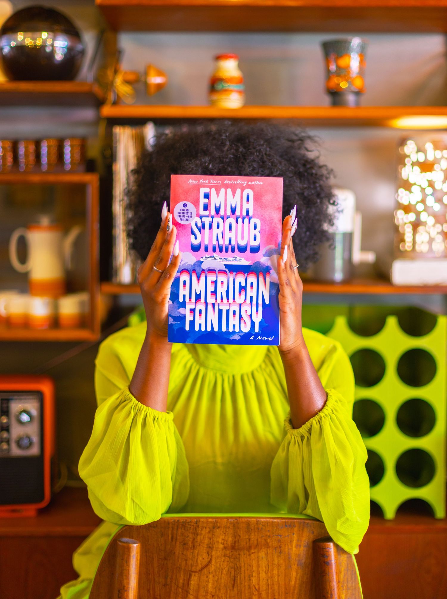 Sequence showing hands holding colorful book covers against a warm-toned background.