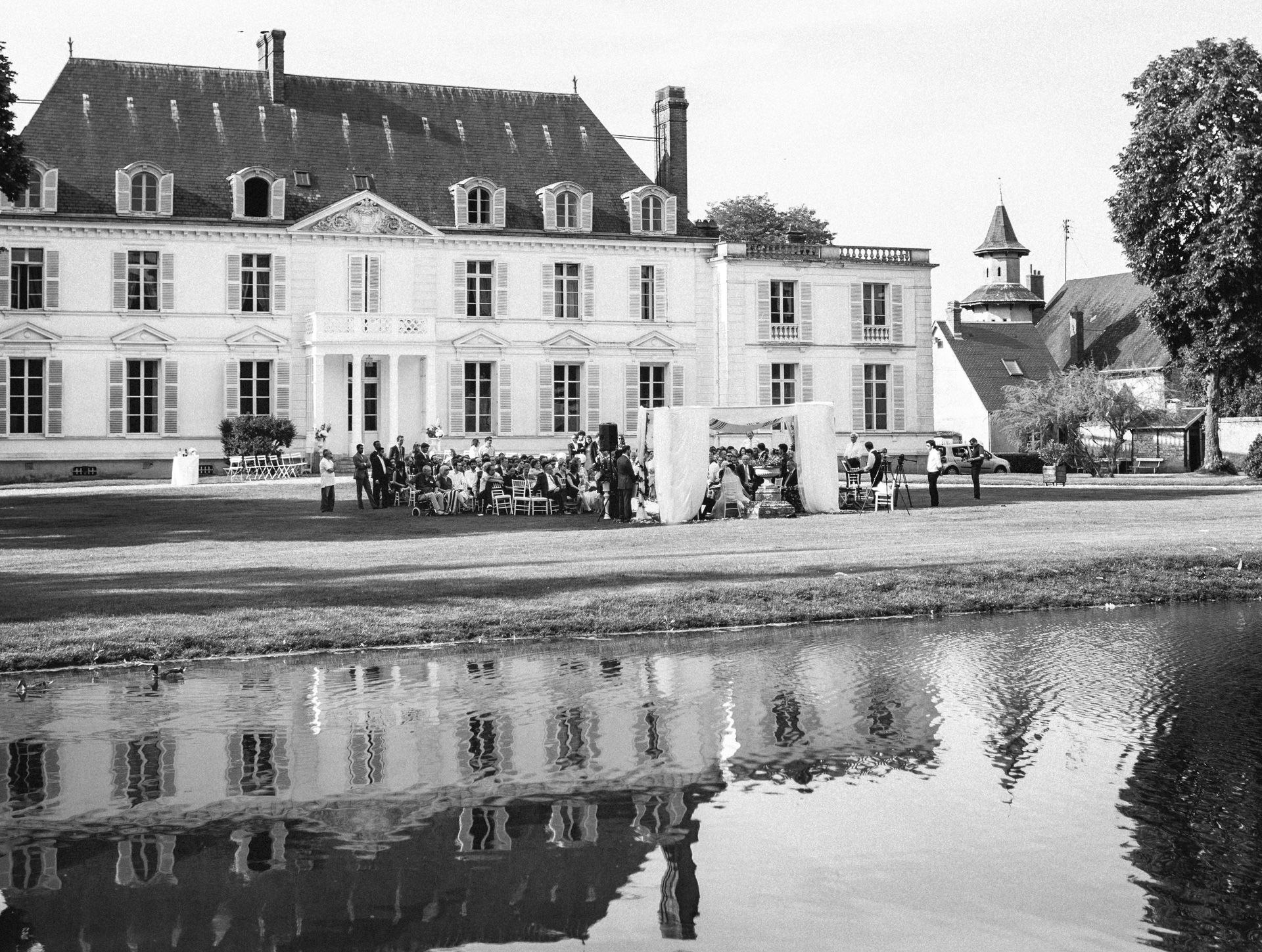 Jewish wedding ceremony under the chuppah in the gardens of Château Barthélemy near Paris