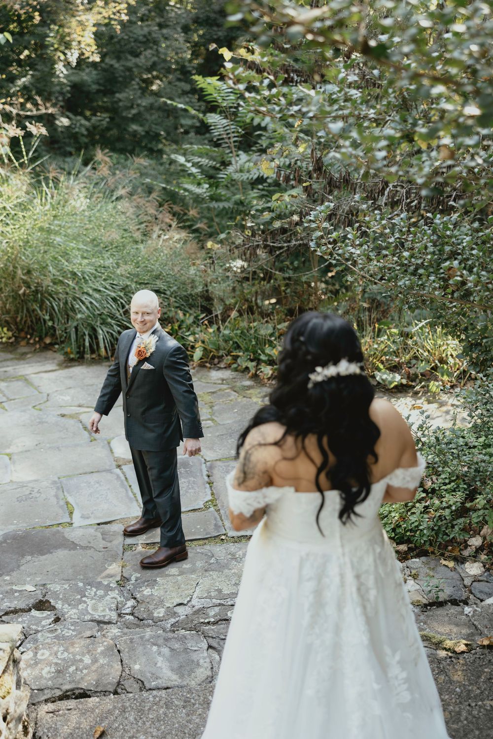 A sequence of four wedding photos shows a couple and an elderly person on stone steps surrounded by lush greenery.