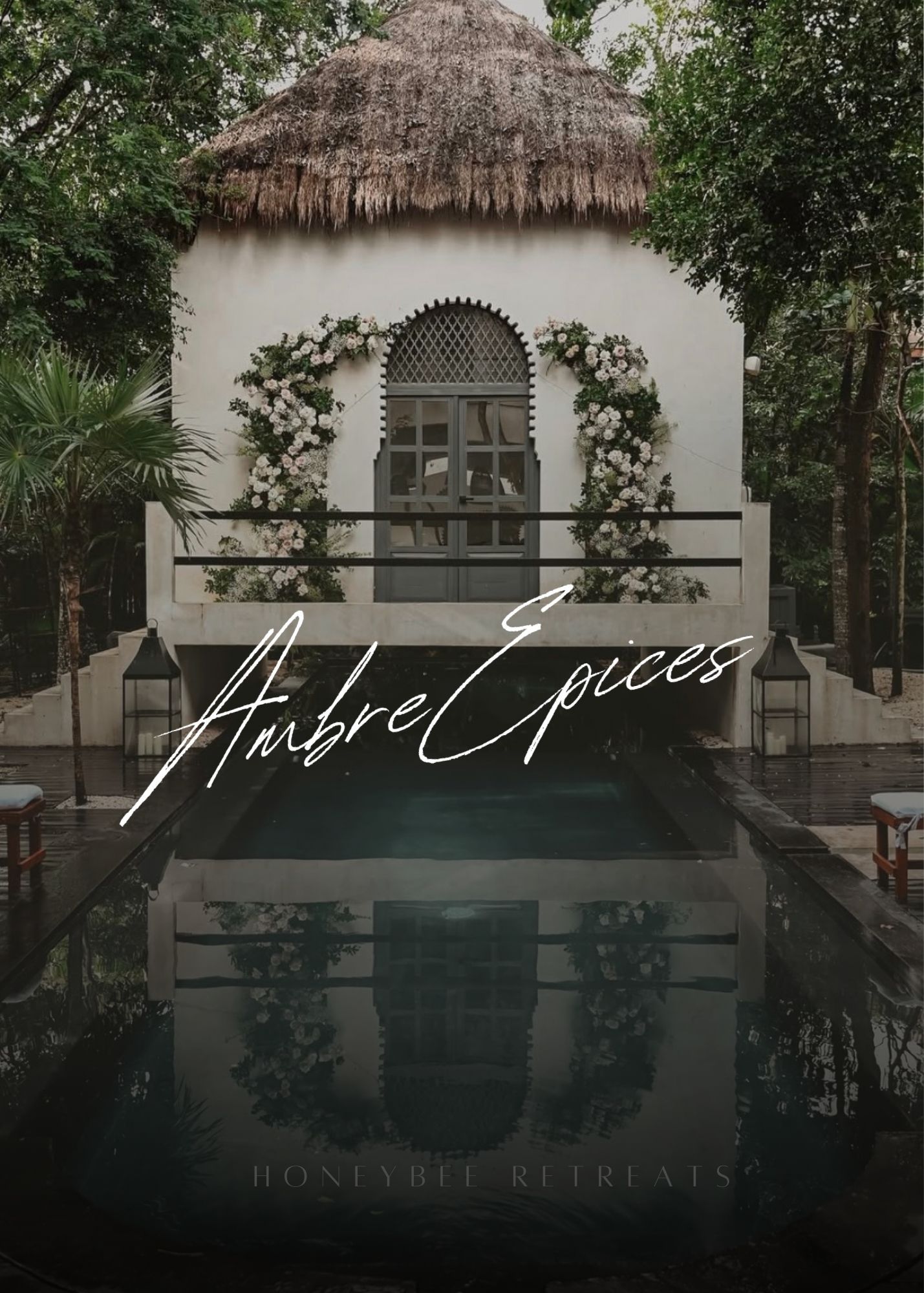 Luxury thatched-roof retreat buildings nestled among tropical foliage with elegant signage and natural landscaping.