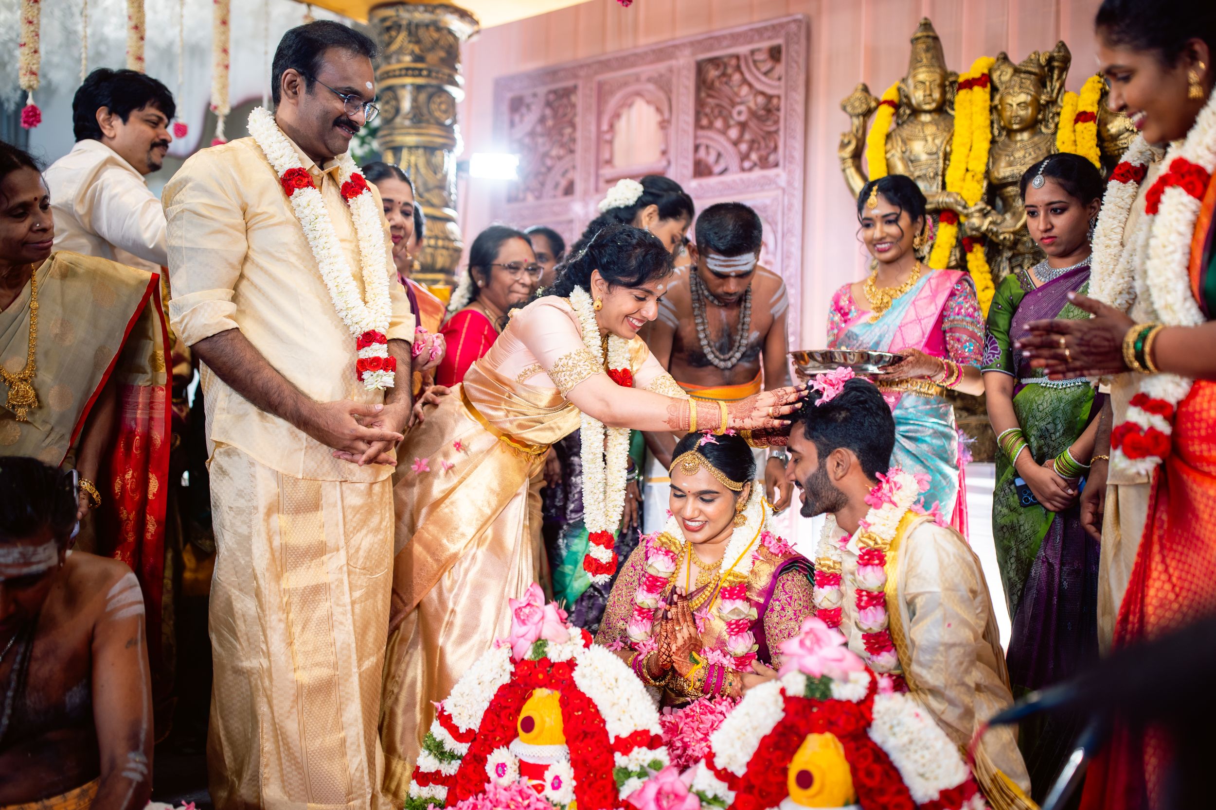 bride mom blessing bride and groom,candid wedding photography by Jeno Photography,trichy
