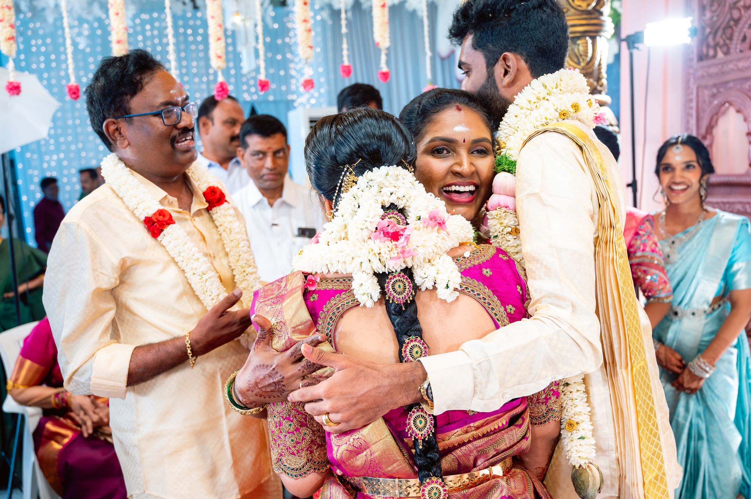 Happy family hug with the groom and bride, Shivaani and Kathir