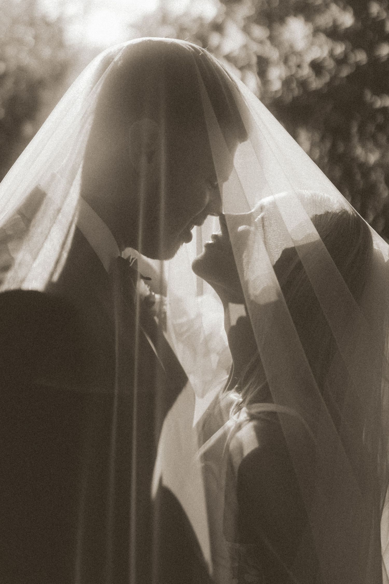 A sepia-toned sequence showing a bride's veil flowing in the wind, creating an ethereal motion effect.