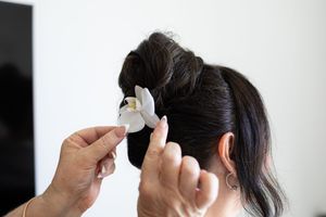 bridal updo, with real flower hair ornament