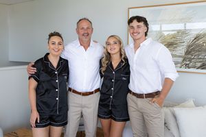 family portrait coordinated black and white outfits, grooms prep