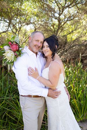 A couple shares an intimate moment during their couple portraits.  Kirsten Graham Photography