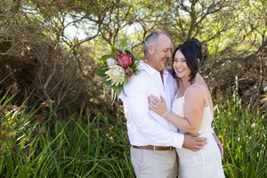 Romantic couple sharing tender moments against a costal backdrop Yallingup