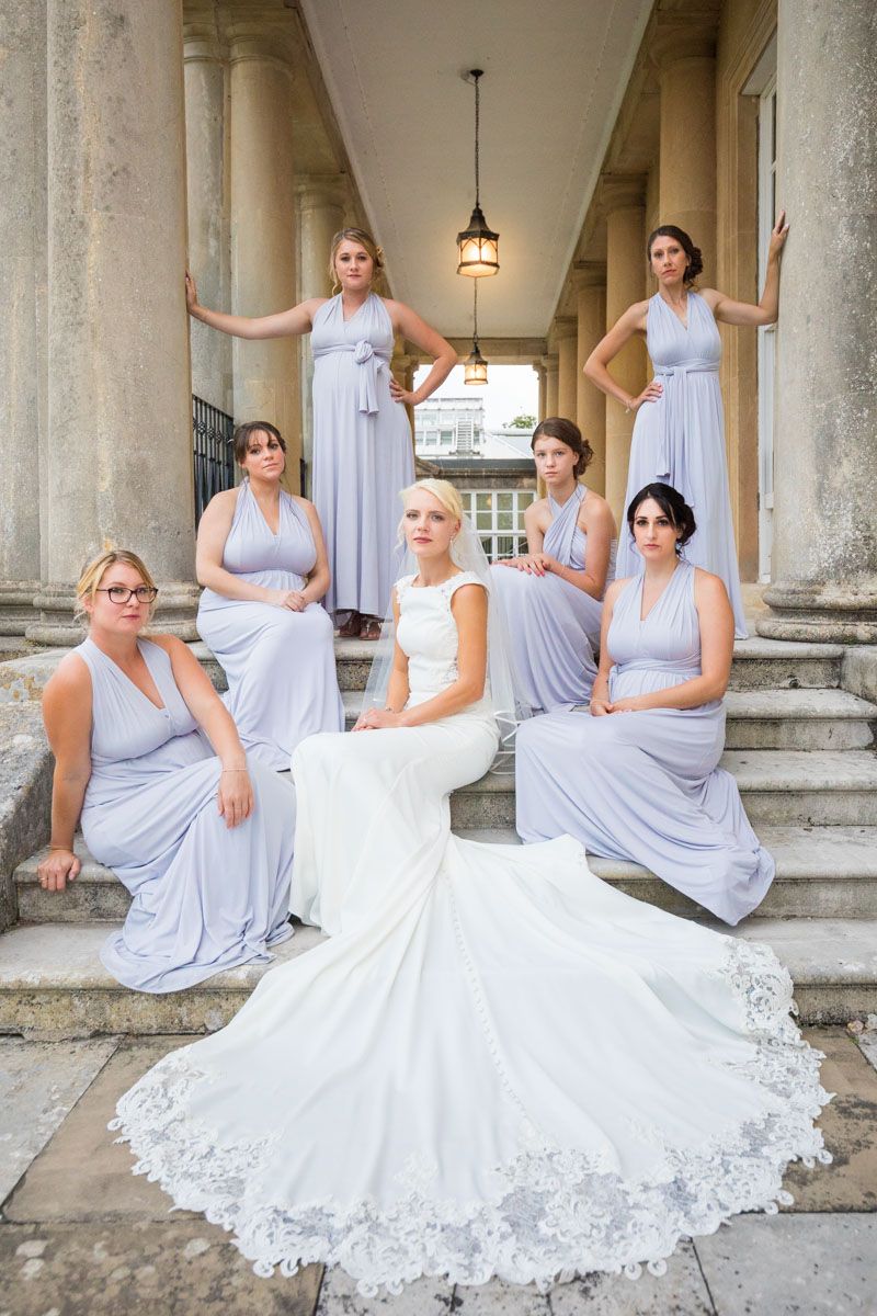 Group of bridesmaids sitting on steps of grand country house | Buxted Park Hotel