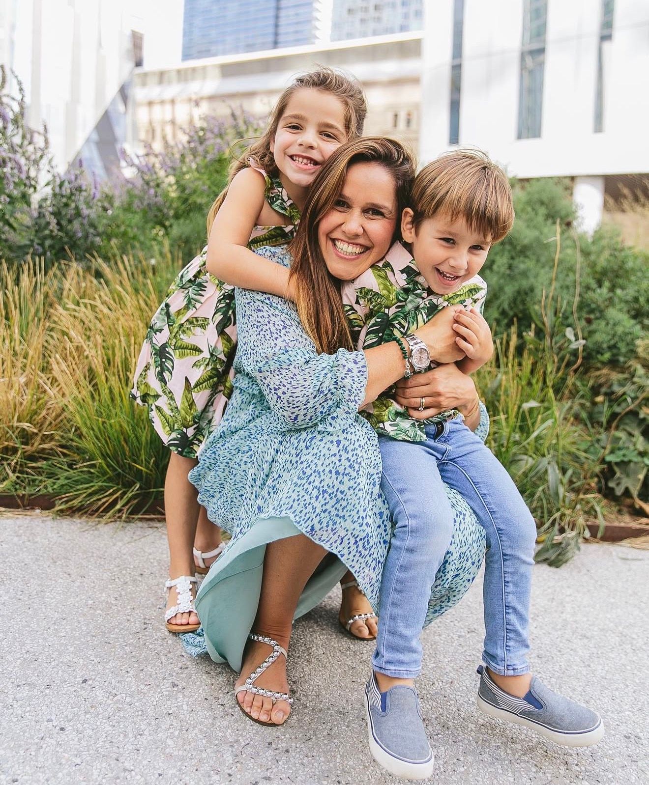 A candid sequence of playful moments captured on a path with ornamental grasses in the background.