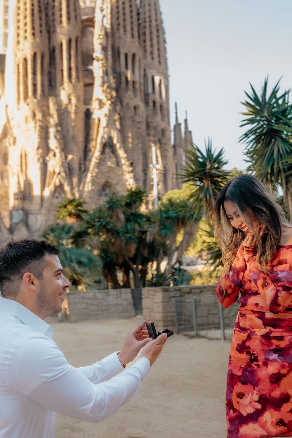 Surprise captured mid kneel Sagrada lake Barcelona Surprise proposal photoshoot Barcelona BarcelonaLoversPH
