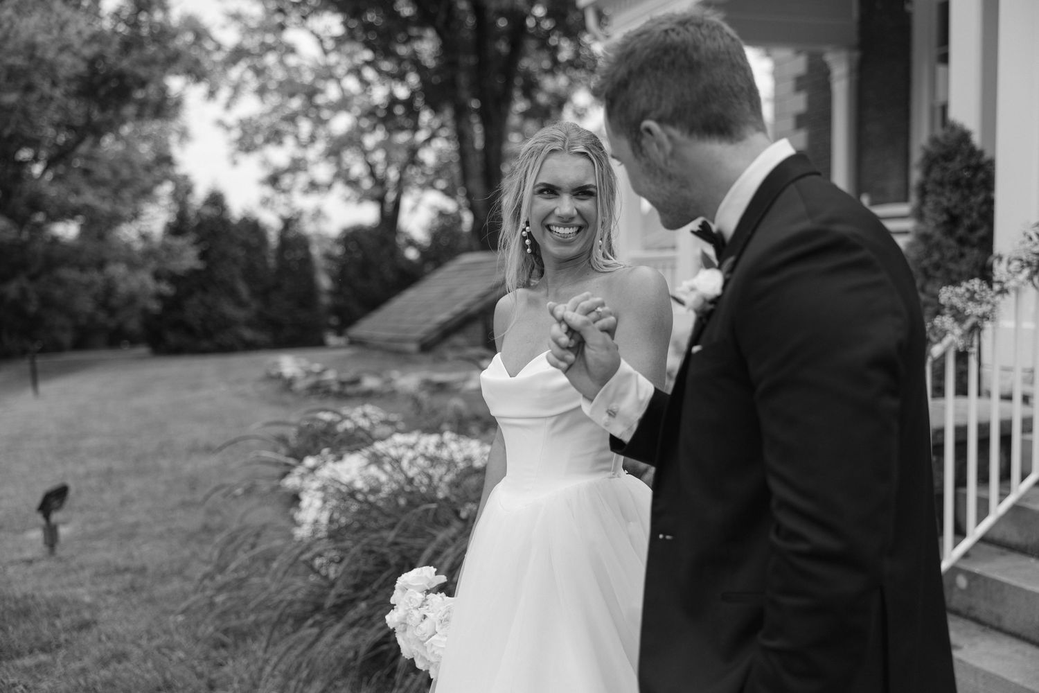 Black and white wedding photo collage showing candid moments between a couple outdoors during their celebration.
