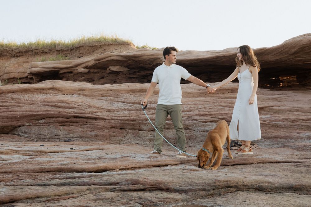 romantic couples engagement session on rocky cliffs PEI destination photography, tourism New Brunswick, travel vacation photograph Moncton