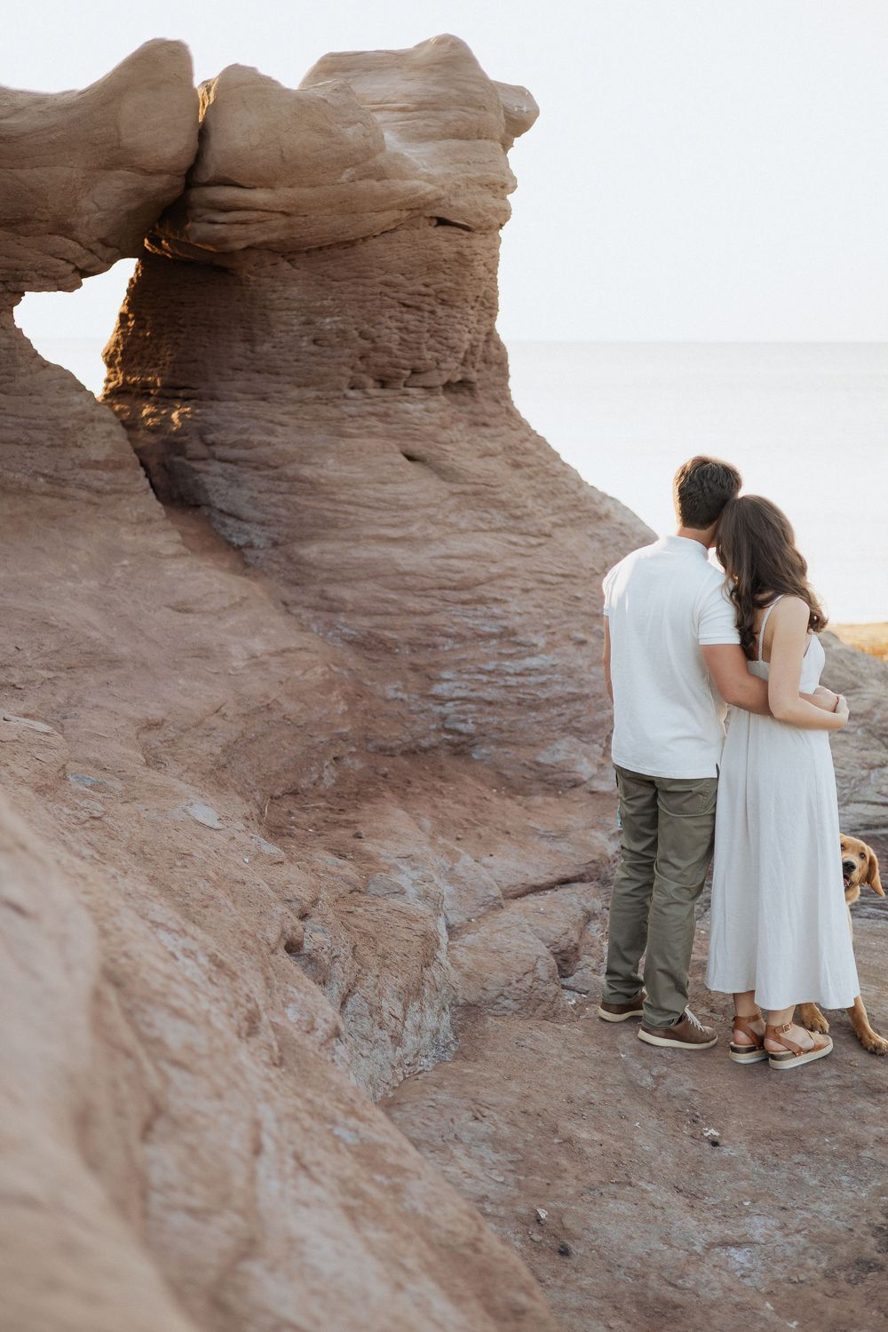 romantic couples engagement session on rocky cliffs PEI destination photography, tourism New Brunswick, travel vacation photograph Maritimes