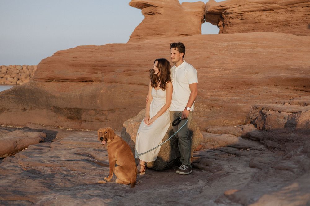 romantic couples engagement session on rocky cliffs PEI destination photography, tourism New Brunswick, travel vacation photograph Moncton