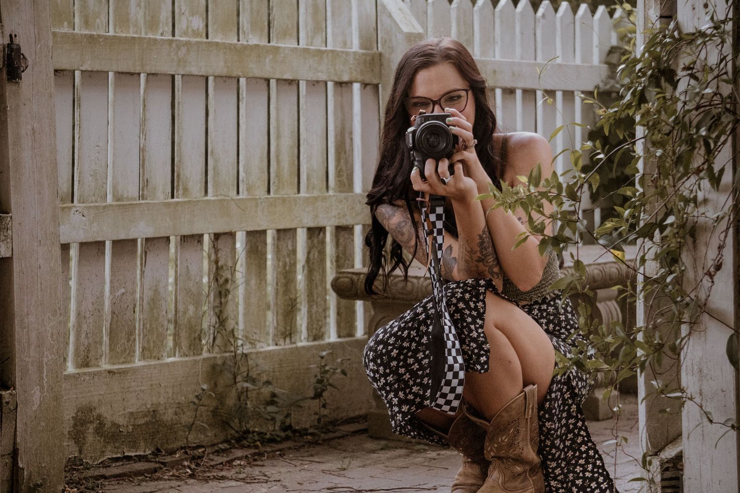 a close up portrait of a photographer holding a camera