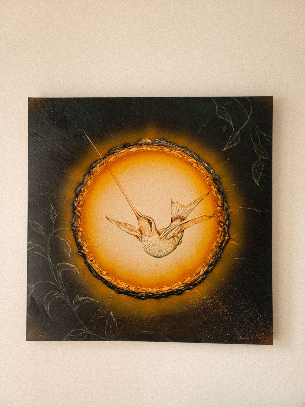 A series of six vintage-style oval frames showing diving birds silhouetted against a glowing orange background.