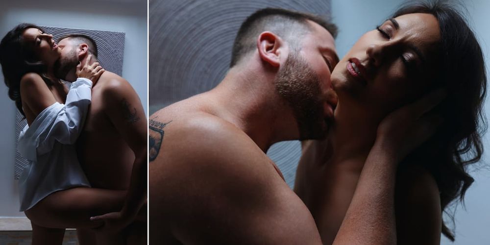 Intimate sensual couple photos showing tender moments and passionate embrace in moody lighting.