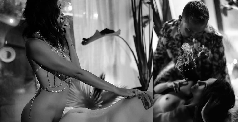 Film noir style black and white photograph showing two silhouetted figures sitting together in moody lighting.