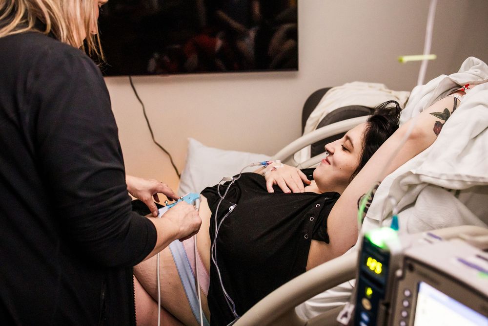 Medical monitoring equipment and care being administered in a clinical setting.