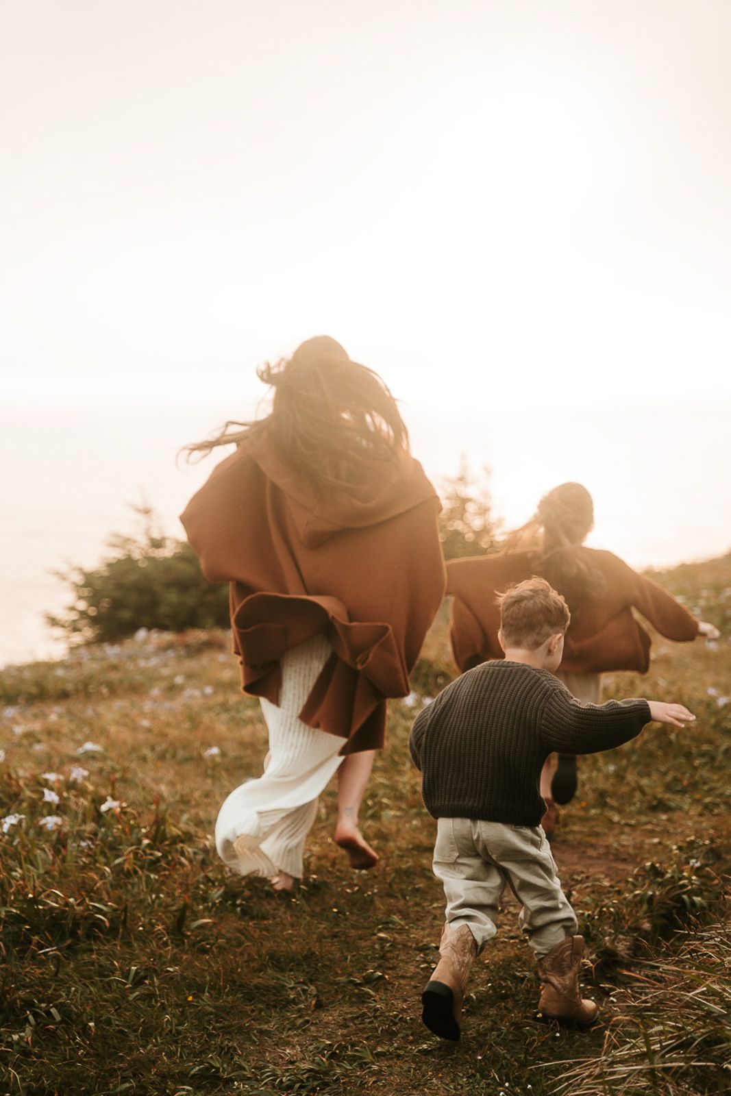Four artistic low-angle shots showing legs of people walking through a rustic field at sunset with a dreamy effect.