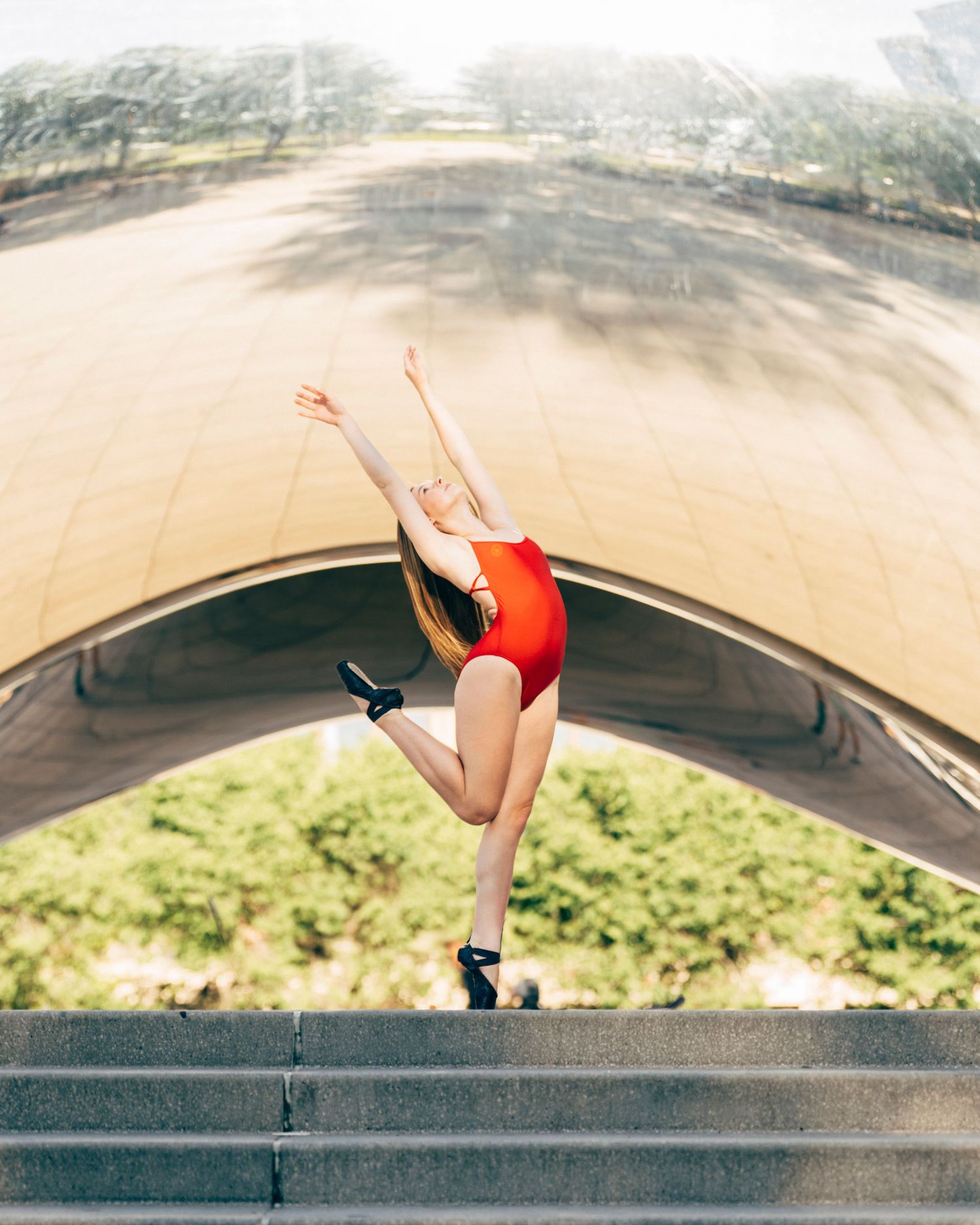 chicago dance photography Ballerina in red leotard posing at The Bean during Joffrey Chicago Summer Intensive