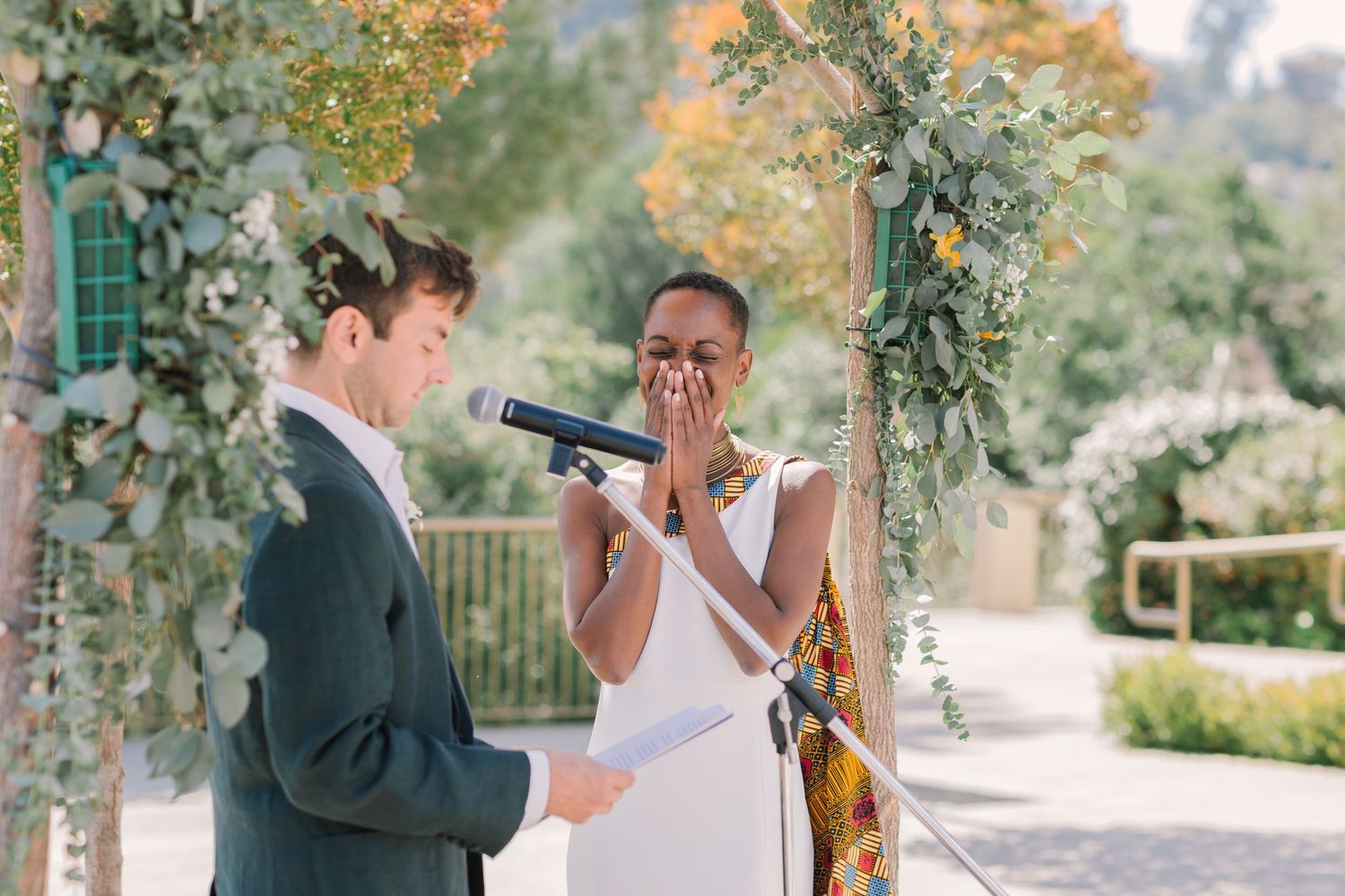 Bride and groom exchanging personal vows during their wedding ceremony at Geneva Terrace in Marin County.