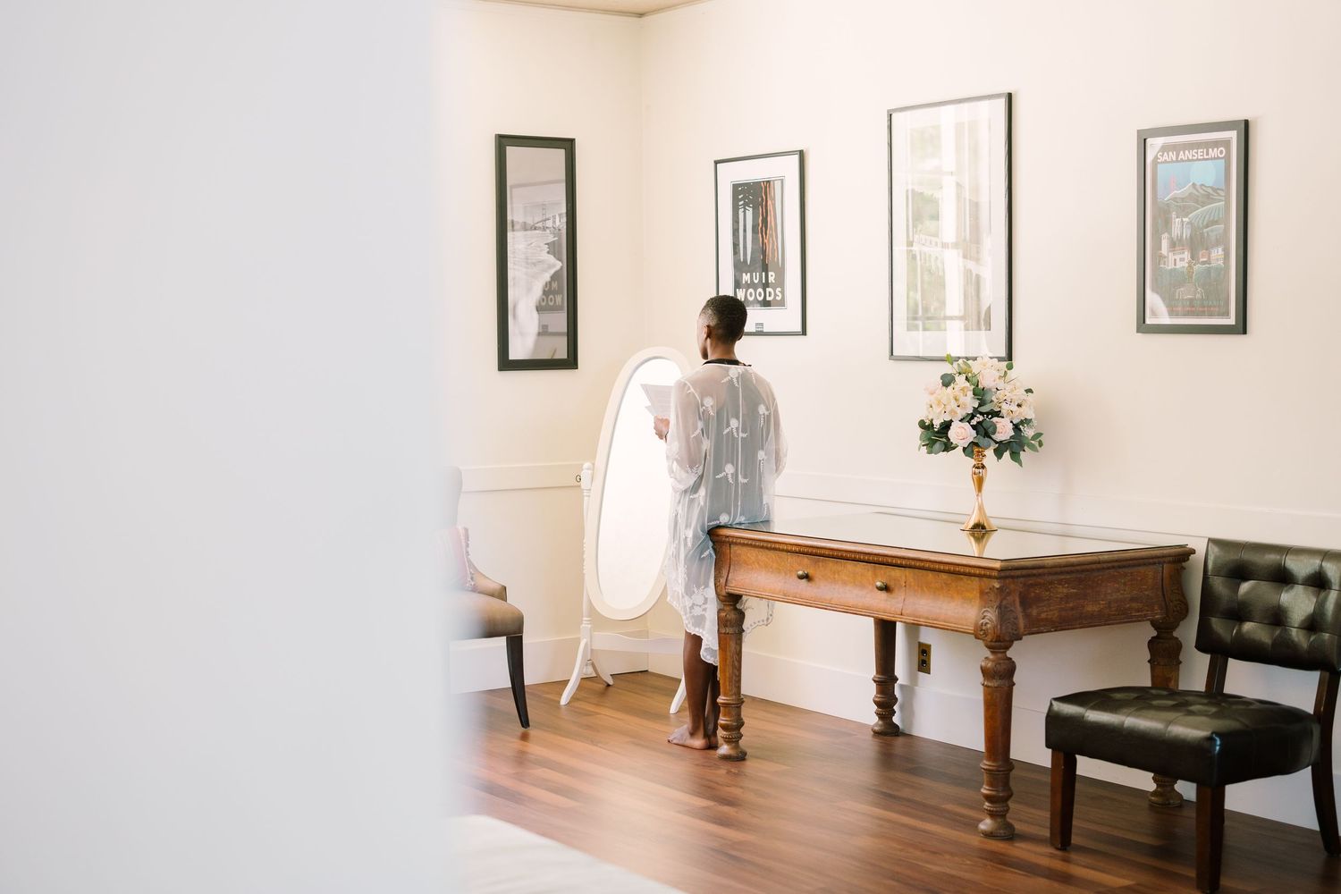 Candid moment of the bride reading her vows through an elegant indoor space at the Redlands University campus.