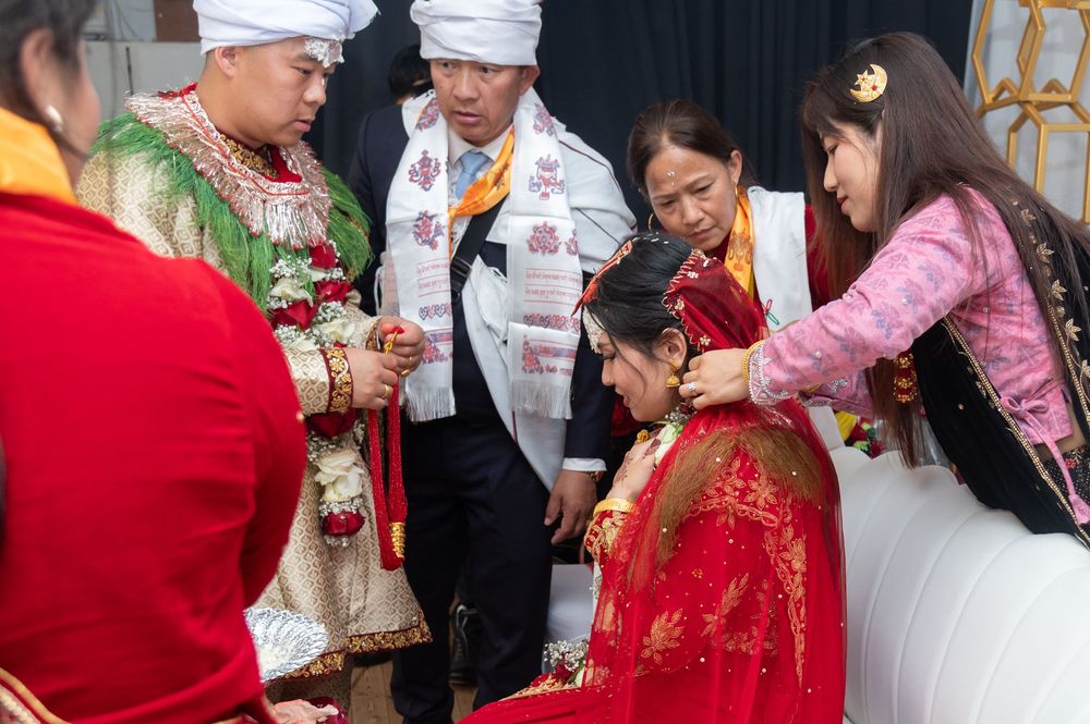Wedding guests participating in traditional Indian ceremony rituals and customs.
