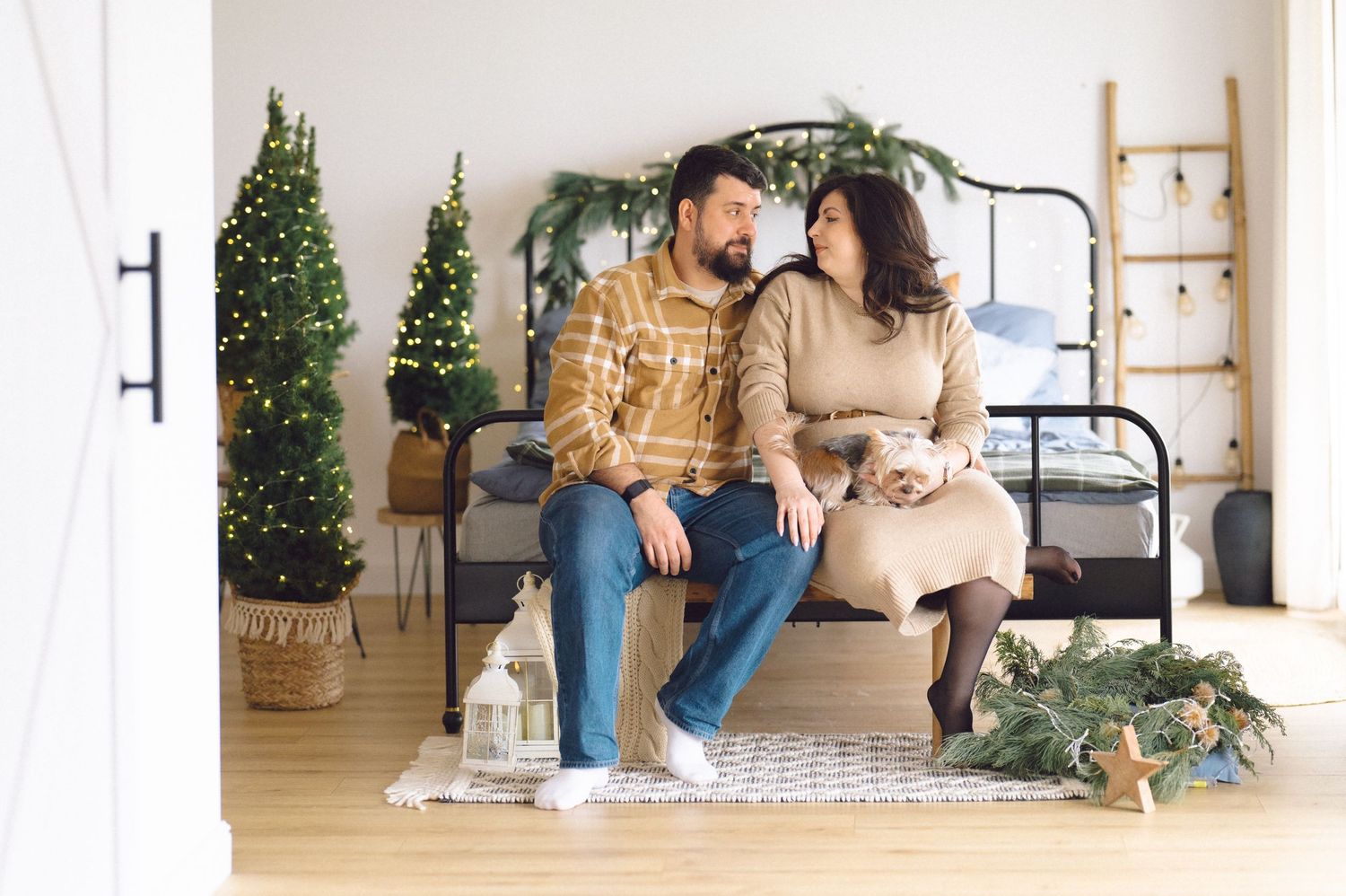 A collection of lifestyle images showing casual poses on a floor setting with holiday decor in the background.