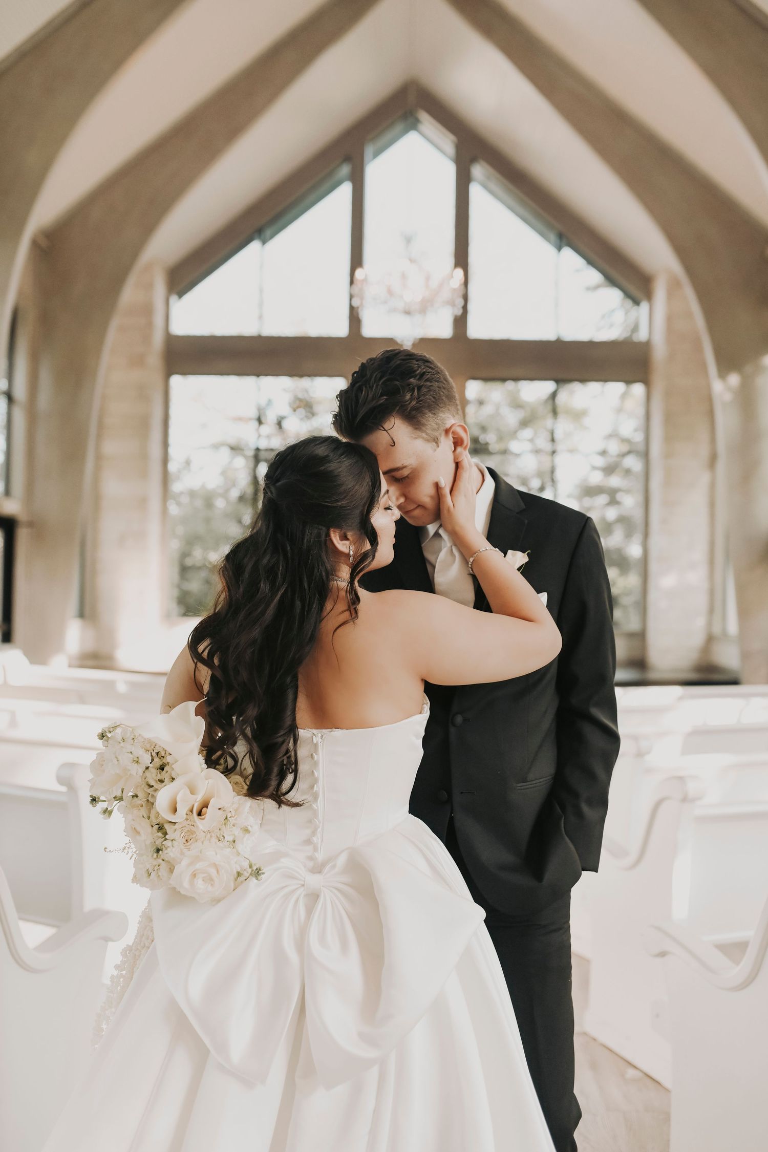Bride and groom sharing a kiss at the altar after the ceremony