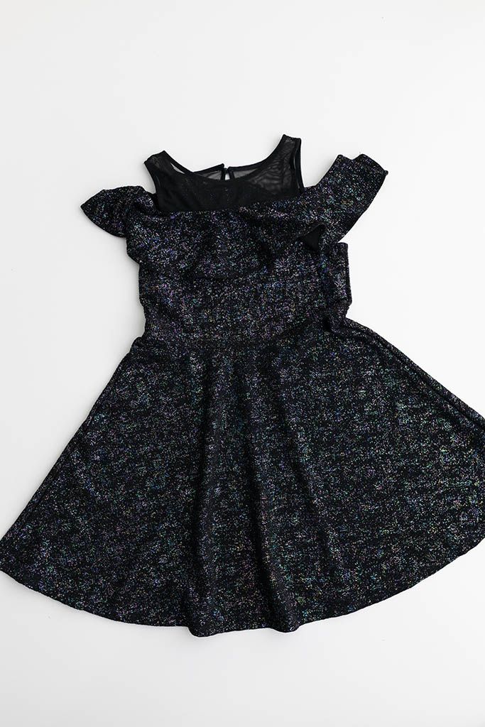 Black multicolor sparkle cold-shoulder girls dress with flutter sleeves and full skirt for child photoshoot.