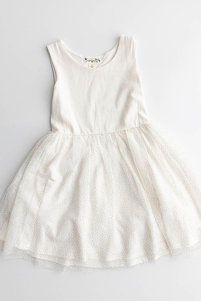 White sleeveless girls dress with sparkle tulle skirt overlay and scoop neckline.