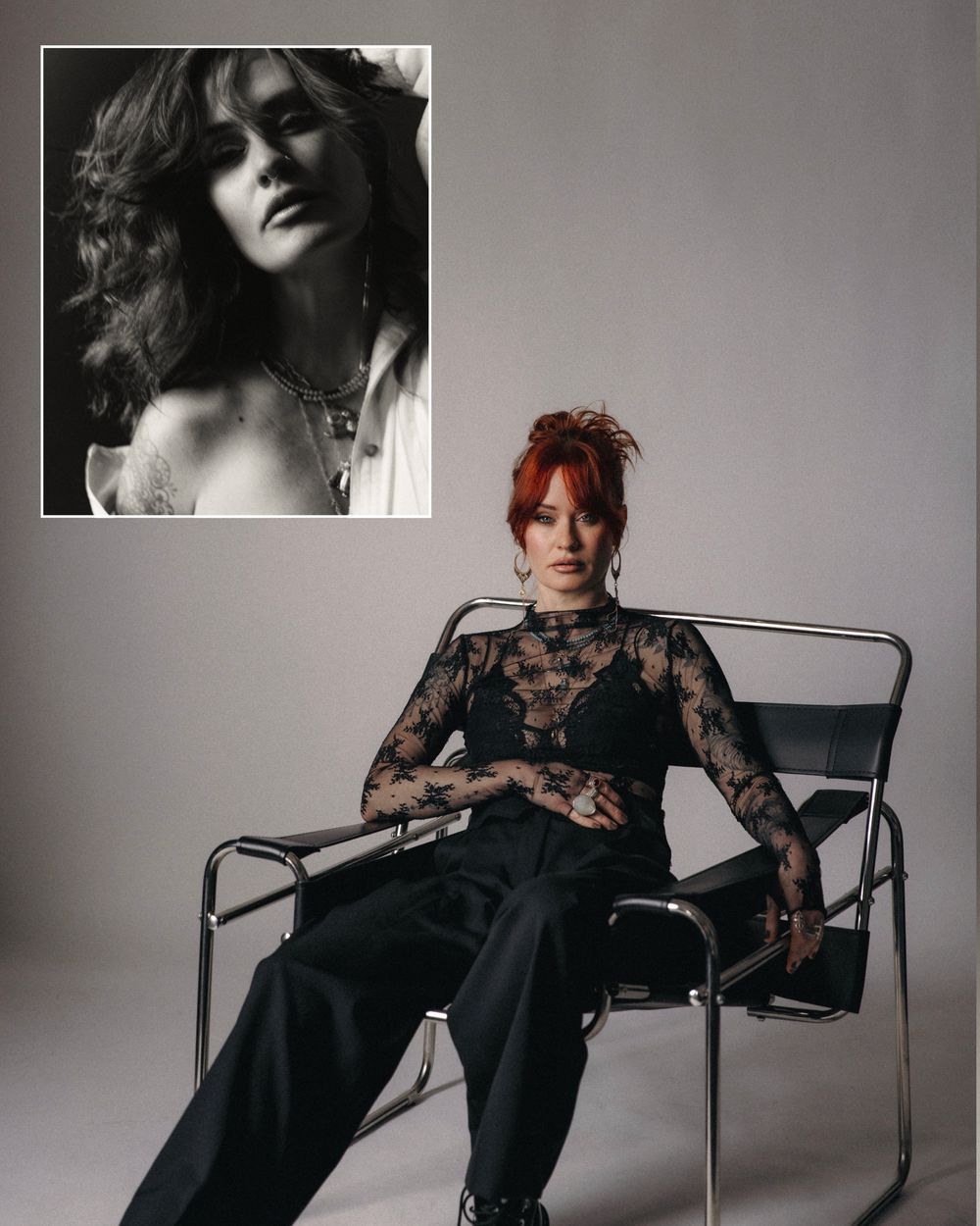 A woman with red hair in black lace top sits in a chrome chair, with a vintage black-and-white portrait inset above.